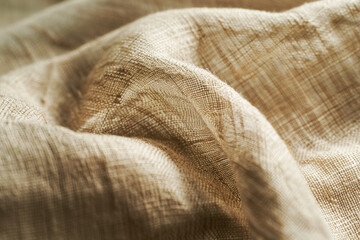 High-Resolution Close-Up of Beige Textured Fabric with Detailed Weave Pattern