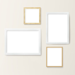 White and wooden picture frame mockups hanging on a beige wall