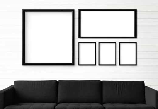 5 blank black picture frames hanging in a white living room