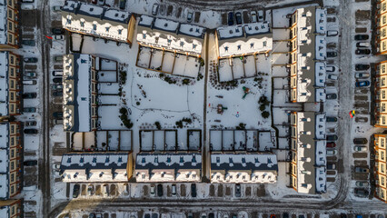 Drone photography of new rural house complex covered by snow during winter morning
