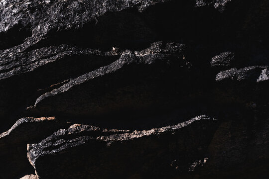 closeup macro shot of dark patterns on granite rock in the Tucson desert