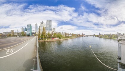 Panoramic picture of the Frankfurt skyline with Main and Friedensbrücke