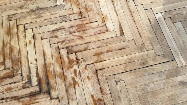 Old parquet background, texture. Old parquet before restoration in an apartment room. Wooden floor background. Old wooden floor in a house.