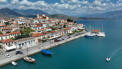 Aerial drone photo of picturesque fishing village of Galaxidi and landmark church of Agios...
