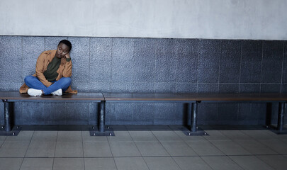 Woman, sad and tired with depression in subway for bad memory, grief and lonely on travel. African...