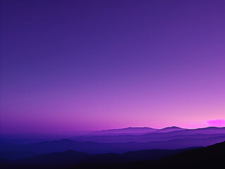 Twilight descends over a layered mountain landscape under a star-speckled purple sky.