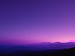 Fototapeten Twilight descends over a layered mountain landscape under a star-speckled purple sky. © tisomboon