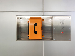 emergency telephone booth On the train station - obrazy, fototapety, plakaty