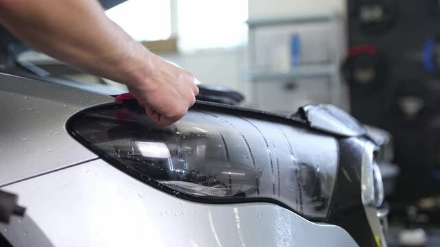 Gluing PPF film on a car with the steam for protection of the car surface against mechanical abrasion, UV, IV and road contamination
