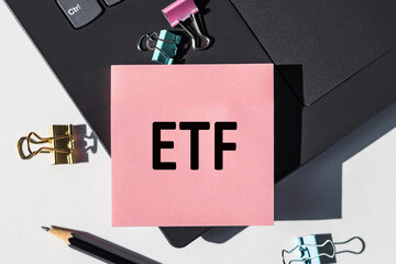 Pink Sticky Note With the Word ETF