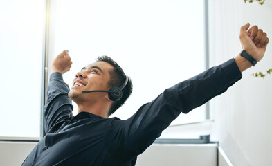 Man, headset and consultant celebrate on sale in office, success and operator for deal or bonus....