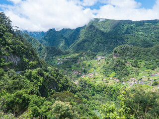 Beautiful view on green hills and valley from resting place, viewpoint at Sao Roque do Faial...