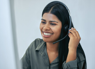 Help desk, phone call and Indian woman in office for customer service, telemarketing and headset at call center. Advisor, agent or virtual assistant in client care, tech support or crm consulting.