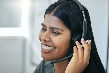 Callcenter, phone call and Indian woman in office for customer service, telemarketing and headset at help desk. Advisor, agent or virtual assistant in client care, tech support or crm consulting.