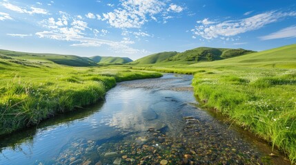 Fototapeta premium A peaceful countryside landscape with rolling green hills and a clear stream flowing through, perfect for relaxation-themed concepts.