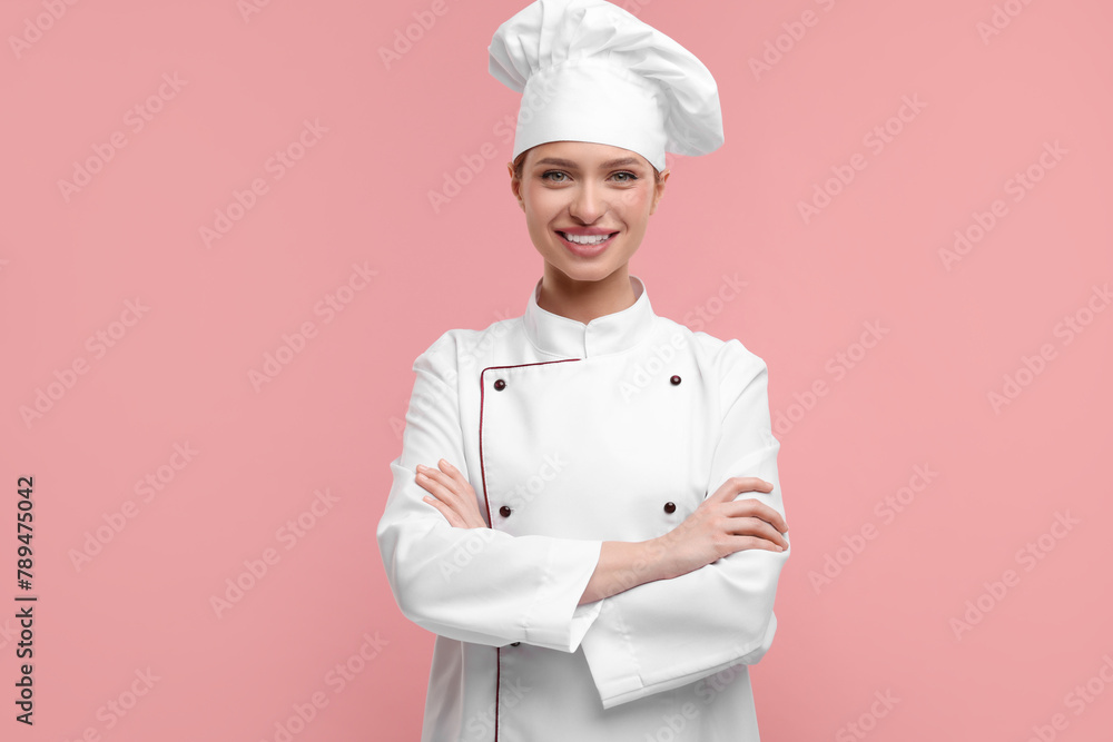 Poster Happy woman chef in uniform on pink background