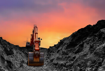 Coal mining in an open pit. Mining excavator loads coal in haul truck in quarry. Excavator digging...