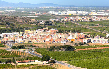 Town with Buildings, houses and streets. City building, aerial view. View of rooftops and streets of La Llosa, Castello, Spain. Roofs of houses from mountains of Castle. View of city from mountain.