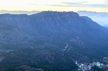 Mountains landscape from Mola De Segart in Sierra Calderona. View on Segart town, municipality in Spain, province of Valencia. Town in mountains hills. House in mountains, aerial view.