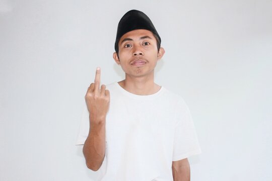 The arrogant and arrogant expression of a young Asian entrepreneur who is seeing his business turnover increase