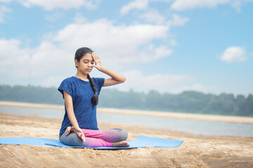 yoga women, athlete indian girl concentrating on pranayama, inhale and exhale breathing exercise in...