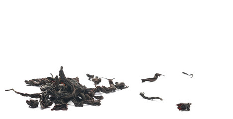 Dry leaves Oolong tea, Camellia sinensis, dark green teas isolated on white, side view - obrazy, fototapety, plakaty