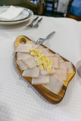 Traditional Alentejo snack chapel of bacon with garlic in a rustic Alentejo restaurant.