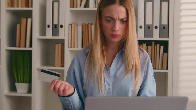 Confused puzzled client female hold bank credit card try to pay online annoyed with payment rejection problem wrong password. Worried girl woman trouble virtual money unsuccessful shopping with laptop