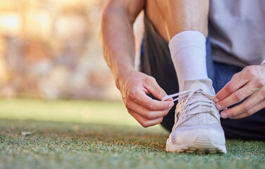 Running, fitness and person tying shoes for cardio workout, marathon training and exercise. Sports,...