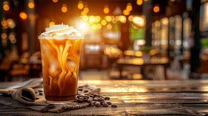 Foto op Plexiglas Glass of a iced coffee with cream milk Cold brew coffee drink with ice Early morning sun light Copy space. Copy space image. Place for adding text or design © JovialFox
