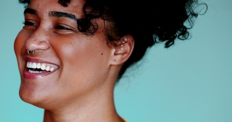One young black woman smiling and laughing close-up face of real authentic expression of happy 20s...