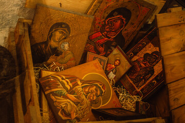 A wooden box of ancient Orthodox icons symbolizing the communist religious repression against Christians - obrazy, fototapety, plakaty