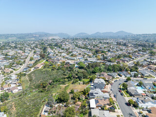 Fototapeta na wymiar Aerial view of house with blue sky in suburb city in San Diego, California, USA.
