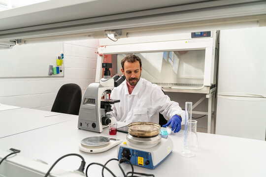 scientist researcher working on biotech laboratory