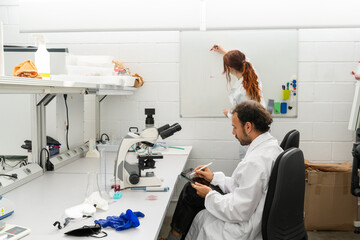 scientists working in biotech laboratory