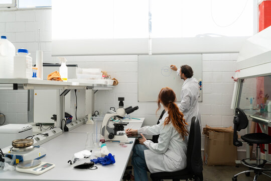 scientists working in biotech laboratory