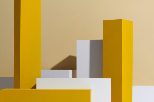 yellow and white geometric box on beige background
