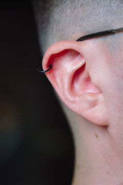 Man with a helix piercing