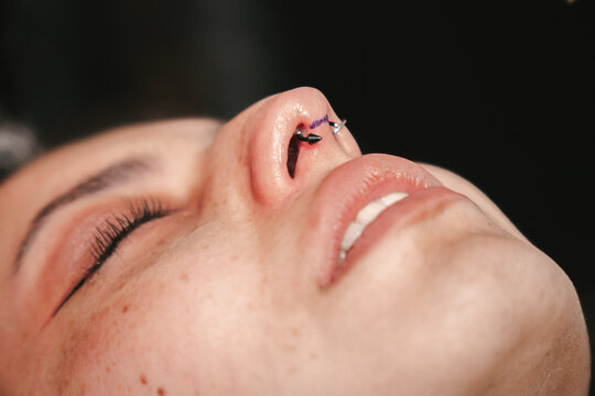 Woman with a septum piercing