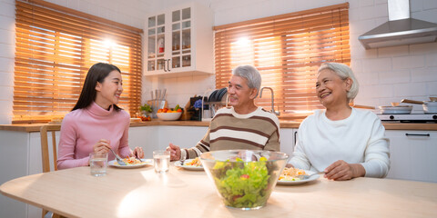 Capture the Joy of Family: Happy Grandparents Enjoying Retirement Indoors, Hugging Their Children...