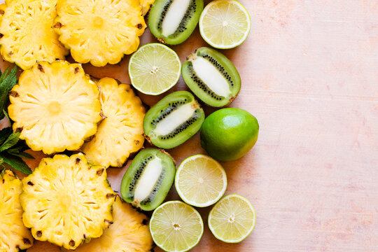 Tropical fruit, pineapple, limes and green kiwi fruit