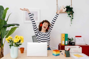 Joyful woman listening to energetic song