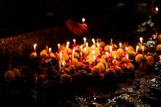 People release marigolds with candles burning during Thai festival