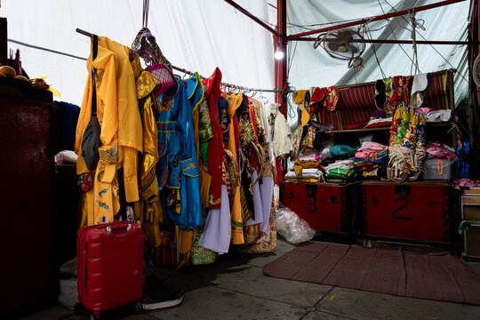 A closet with traditional Thai costumes backstage at a public opera