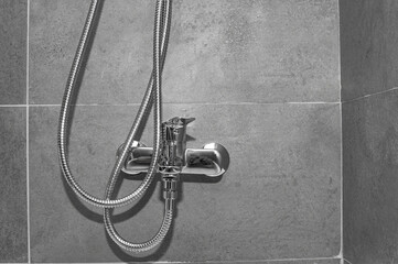 Chrome shower faucet close up in a bathroom