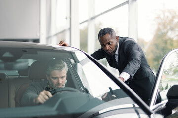 Sales advocate consultation modern vehicle showroom purchase