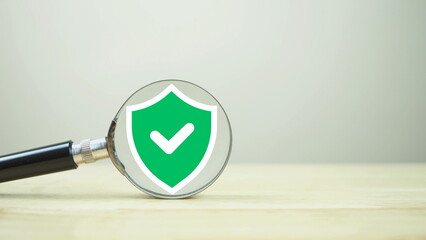 Green security safety with check mark icon inside of magnifier glass for focus cyber security and...