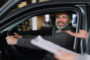Smiles satisfaction car shop cheerful client buy vehicle