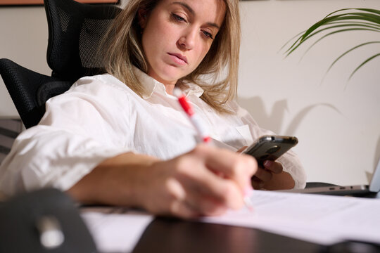 Concentrated Effort: Businesswoman Balancing Workload