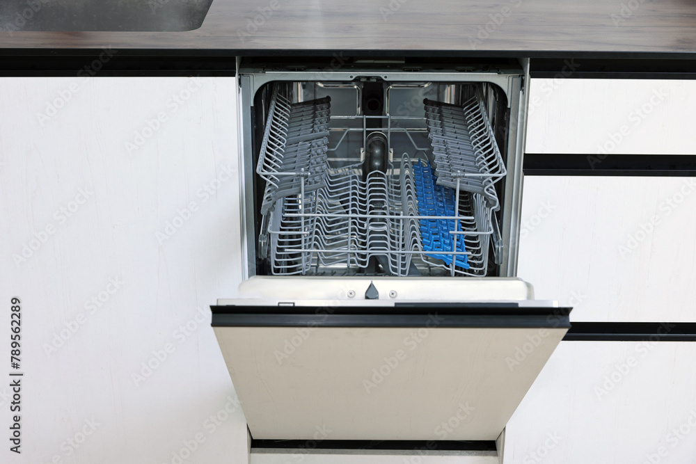 Sticker Built-in dishwasher with open door indoors. Home appliance